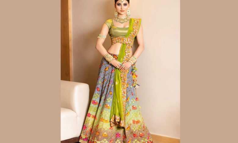 Urvashi Rautela giving traditional vibes in bandhani lehenga from Asha Gautam along with statement jewellery for a recent wedding!